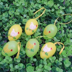 Set of 6 Easter egg hanging ornaments with hen patterns on green artificial leaves