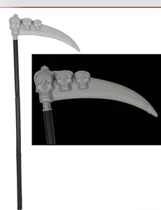 Detail view of Halloween scythe prop with three skull carvings and long black handle