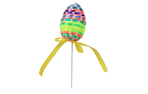 Detail of colorful woven Easter egg stake with yellow ribbon bow for festive floral decoration