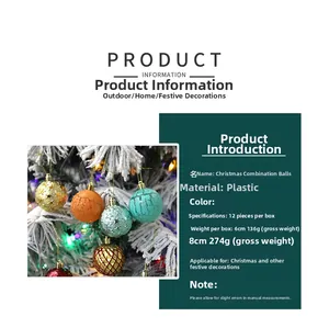 Detail of multi-colored painted Christmas baubles hanging on a white frosted tree