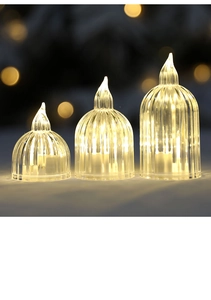 Close-up of warm LED acrylic candle lights with vertical stripes in three heights