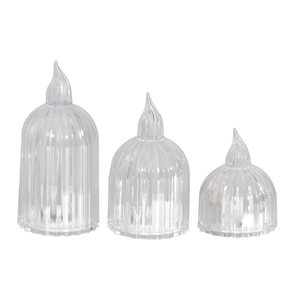Three transparent LED pillar candles with vertical stripes and flame-shaped tips