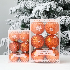 12pcs orange Christmas ball ornaments with star textures on a snowy holiday tree