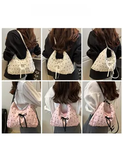 Detailed views of women's bubble pleated crescent bags with bows in white and pink