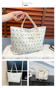 Detailed views of a white textured tote bag with black patterns and a gold bow detail