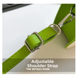 Close-up of bright green PU leather adjustable shoulder strap with silver buckle detail