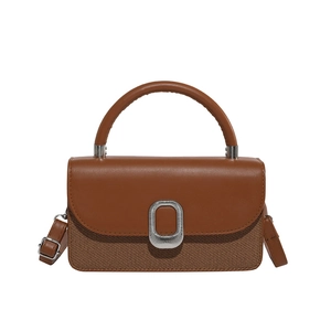 Brown leather and fabric crossbody bag with vintage metal buckle and top handle