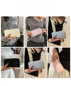 Close-up showing various colors of long snakeskin pattern wallets with zipper closure