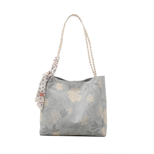 Floral print tote bag with woven straps and silk scarf detail in grey and yellow