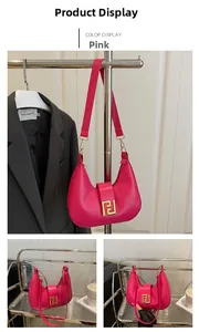Detail of a pink PU leather hobo bag with a gold geometric square buckle and wide strap