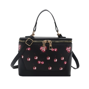 Retro black cherry print bucket bag with dual zippers and adjustable shoulder strap
