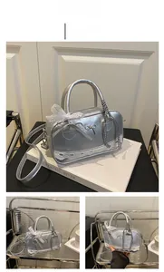 Detail of silver metallic ballet-core bowling bag with lace trim and bow charm