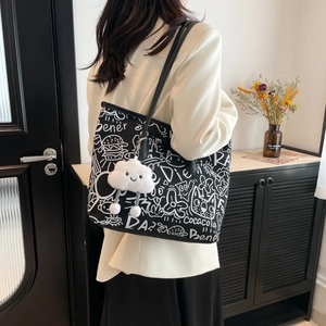 Graffiti tote bag in black PU leather with white cartoons and cloud plush charm