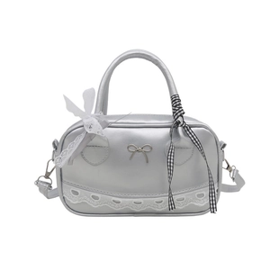 Silver metallic ballet-style bowling bag with lace trim and bow charm details