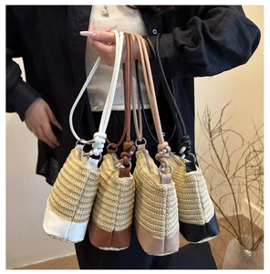 Detail view of woven bucket bags in four colors showing leather straps and textures