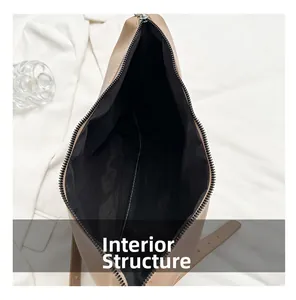 Vue macro de la structure interne du sac fourre-tout beige avec doublure noire et fermeture