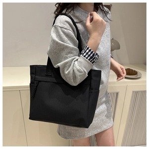 Large capacity black corduroy tote bag with woven texture for professional commute wear