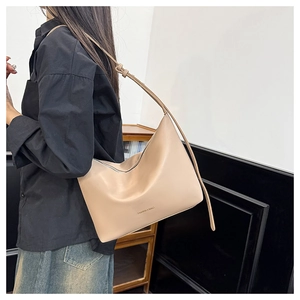 Detail of beige faux leather tote showing the Fashion & Bags text and adjustable strap