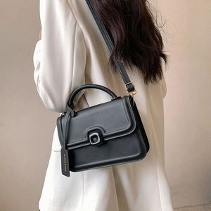 Black matte leather crossbody handbag with square metal buckle and fashion logo tag