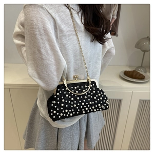 Elegant beaded evening bag with faux pearls, metal top handle and golden chain strap detail