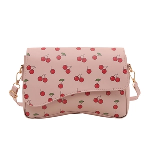 Pink crossbody bag with cherry prints and wavy flap design on white background