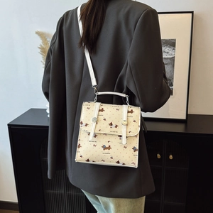 Mini beige dachshund and cherry print crossbody bag with white adjustable strap and handle