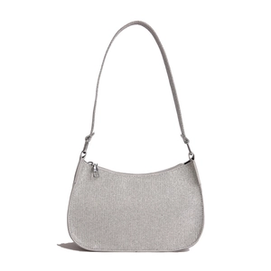 Silver glittering crescent shoulder bag with adjustable strap and metallic fabric finish