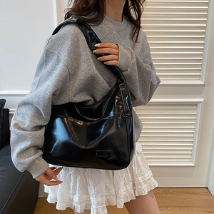 Chic black patent leather oversized hobo shoulder bag with glossy finish for women