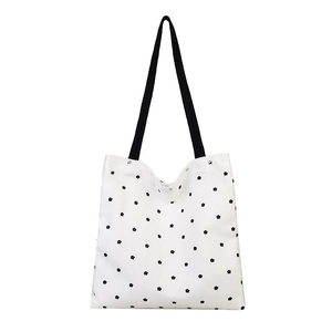 Floral canvas tote bag with black lace trim and reinforced straps for summer daily wear