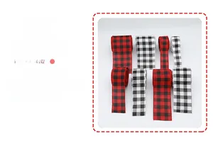 Close-up of red, black, and white plaid Christmas ribbons with detailed woven texture