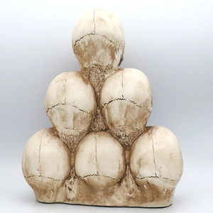 Stacked resin skulls pyramid sculpture for Halloween haunt and gothic party decoration