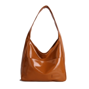 Caramel brown large hobo tote bag in glossy leather with wide shoulder strap