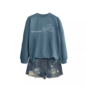 Blue Thank a Farmer long sleeve sweatshirt paired with distressed denim shorts on white background