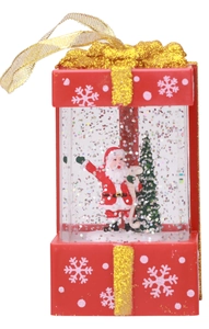 Detail of red Christmas gift box lantern with Santa Claus and sparkling colorful glitter