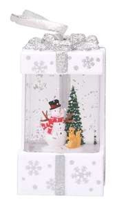 Close-up of a white Christmas gift box lantern with snowman, squirrel and glitter water