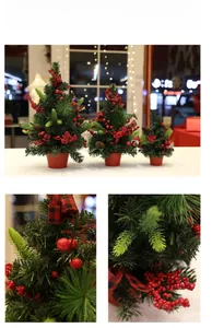 Detail view of mini artificial Christmas trees with red berries and pine cones