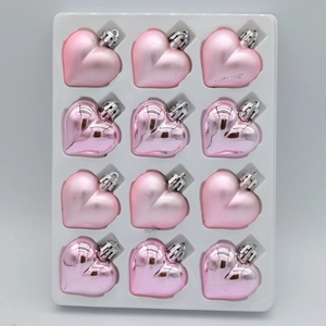 12-piece heart-shaped Christmas ornaments in matte and glossy pink finish with silver caps