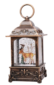 Macro view of vintage bronze Christmas lantern featuring reindeer scene and glitter flakes