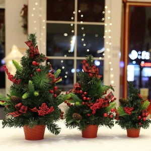 Three-piece mini tabletop Christmas trees with pine cones, red berries and plaid bows