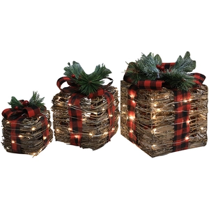 Three-piece lighted rattan Christmas gift boxes with bows and pine needles on white background