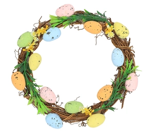 Close-up of Easter wreath with colorful speckled eggs and green leaves on natural rattan base