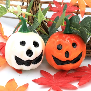Mini Halloween foam pumpkins with smiling faces, orange and white festive table decor