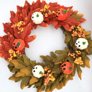 Halloween maple leaf wreath with foam pumpkins and berries for festive door decoration