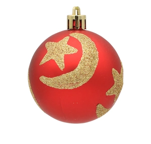 Detail of red matte Christmas ball featuring golden glitter moon and stars patterns