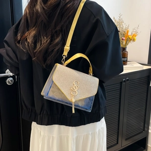 Chic quilted PVC crossbody bag with gold sequins, letter logo, and yellow shoulder strap