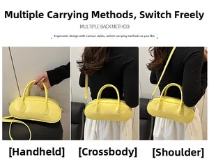 Three-way carry style for yellow PU leather Boston bag shown in hand and over the shoulder