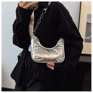 Close-up of silver hobo bag with metallic leather texture and chunky chain strap