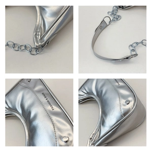 Détails du sac demi-lune argenté montrant les coutures, la finition métal et les rivets