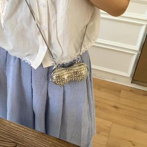 Peanut shaped mini crossbody bag with white rhinestones and silver snake chain