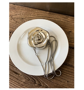 Detailed view of 3D silver rose petal design acrylic mini evening bag with metal chain